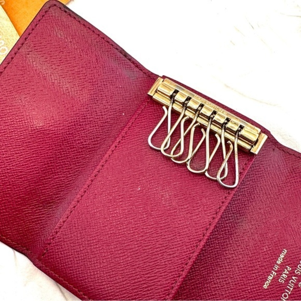 AUTHENTIC Louis Vuitton key holder. Monogram pattern. Magenta interior. - Picture 3 of 15